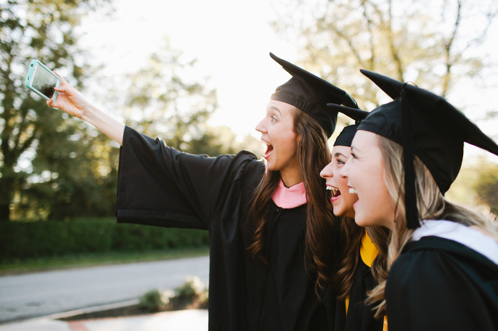 Young women in graduation gowns