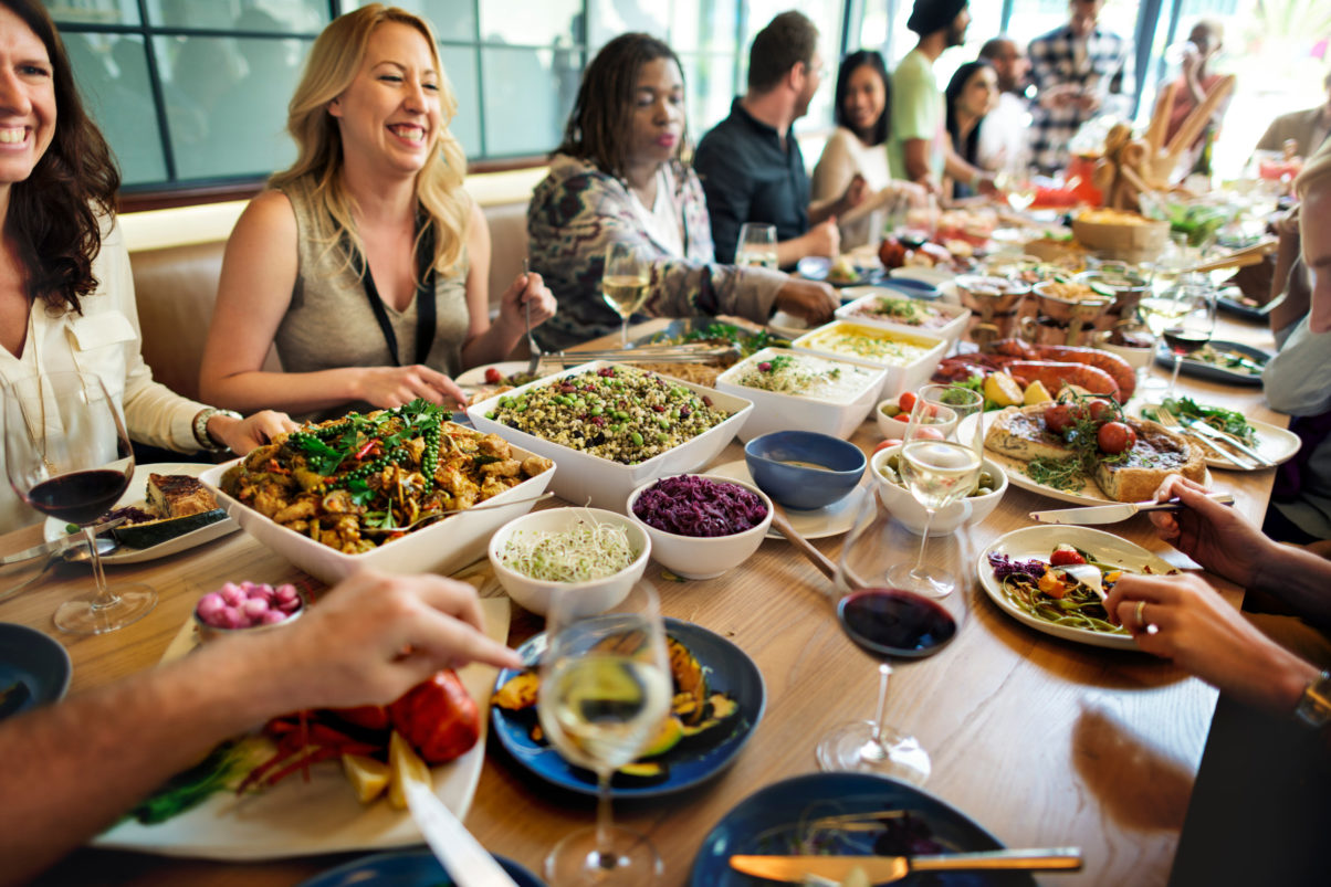 A group enjoying a buffet style dinner at a restaurant