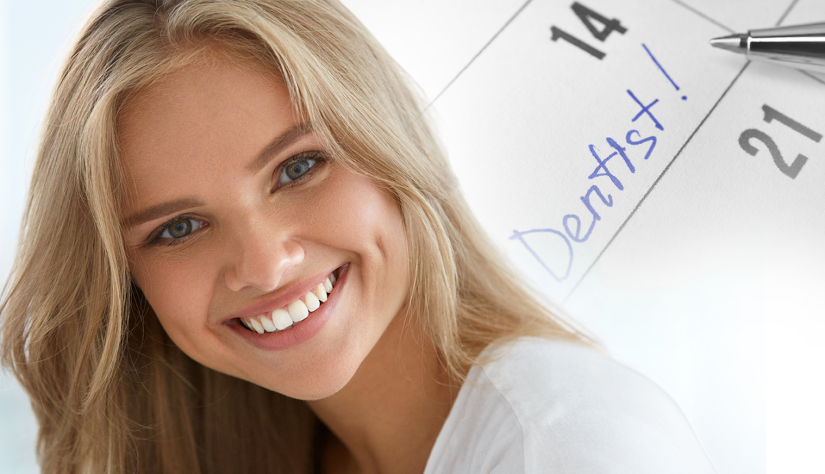 woman smiling with a day planner in the background