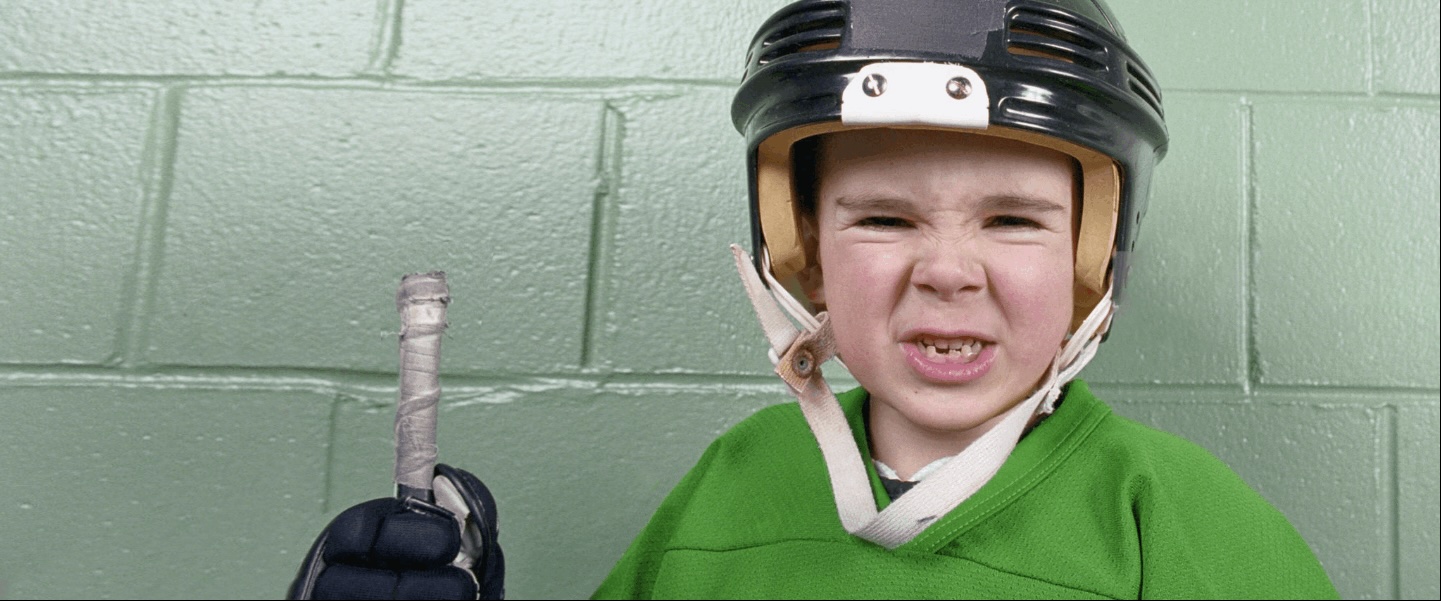 Little boy in hockey clothes
