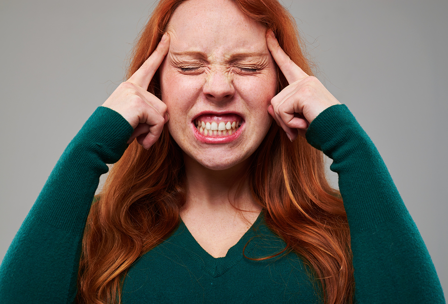 red head woman grinding teeth