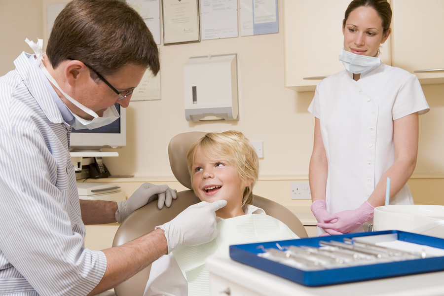 Child receiving dental treatment