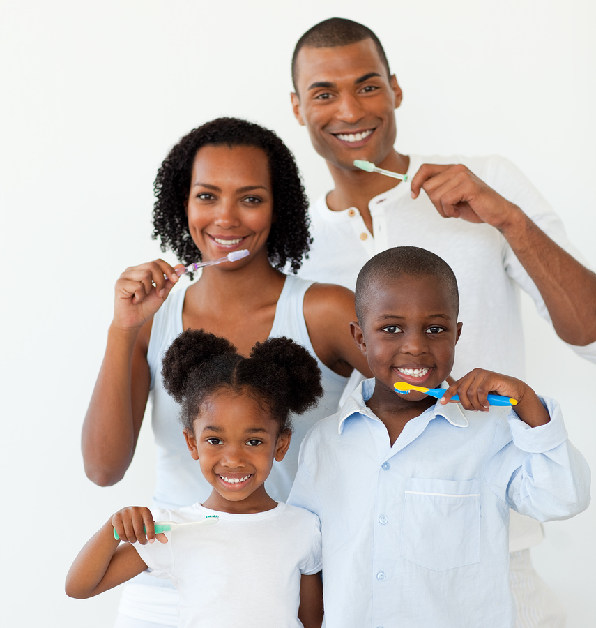 Afro-american family brushing their teeth in the bathroom