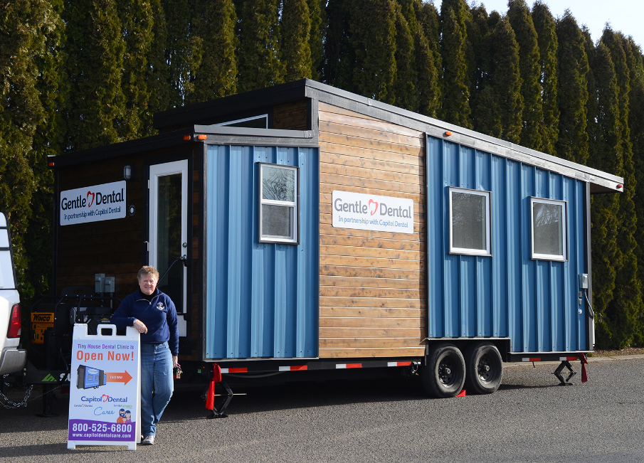 Gentle Dental Tiny House with a now open sign