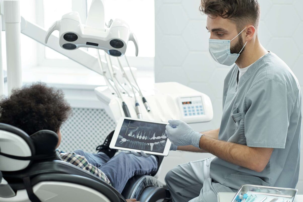 dentist-in-mask-gloves-and-uniform-interacting-wi-2022-01-20-15-55-03-utc